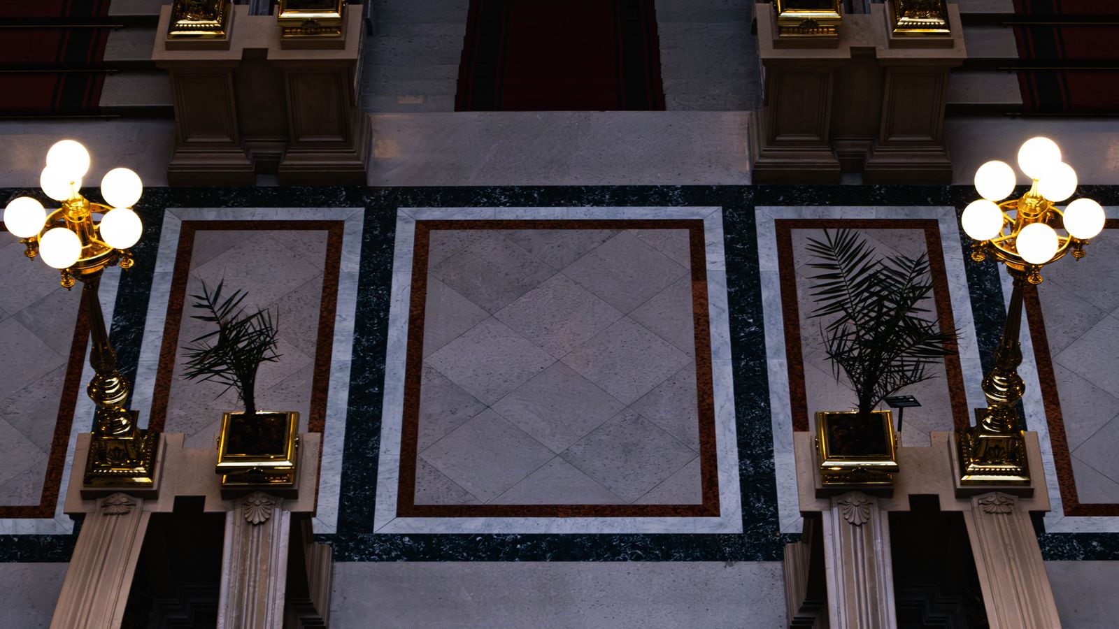 Long runner rug placed along a hallway floor between two rooms