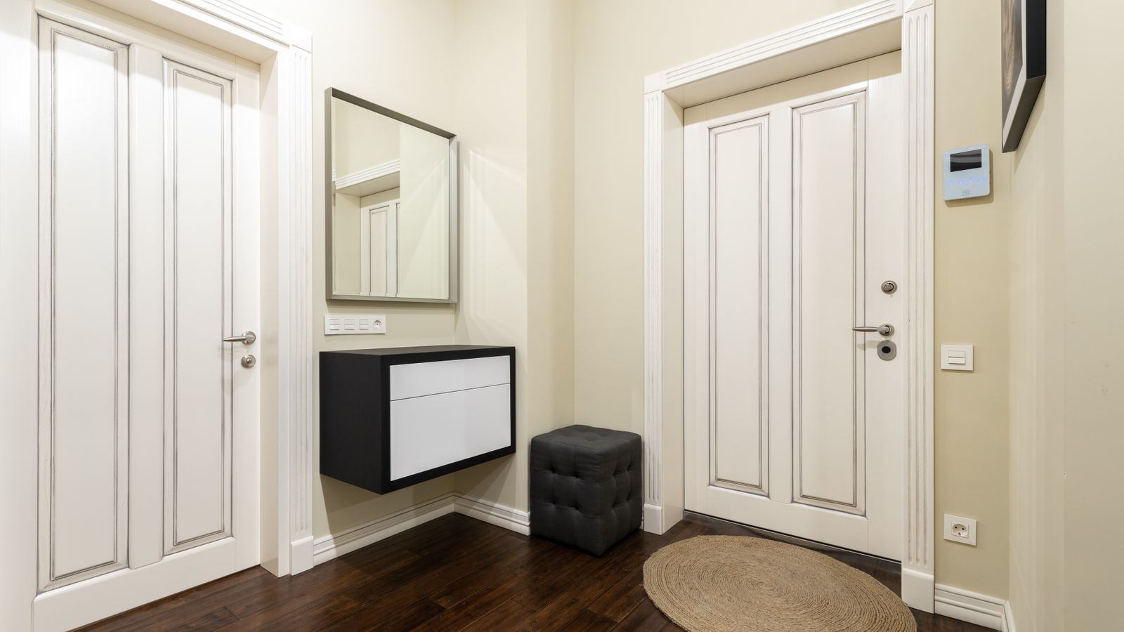 Narrow kitchen runner rug placed in front of a stove and countertop