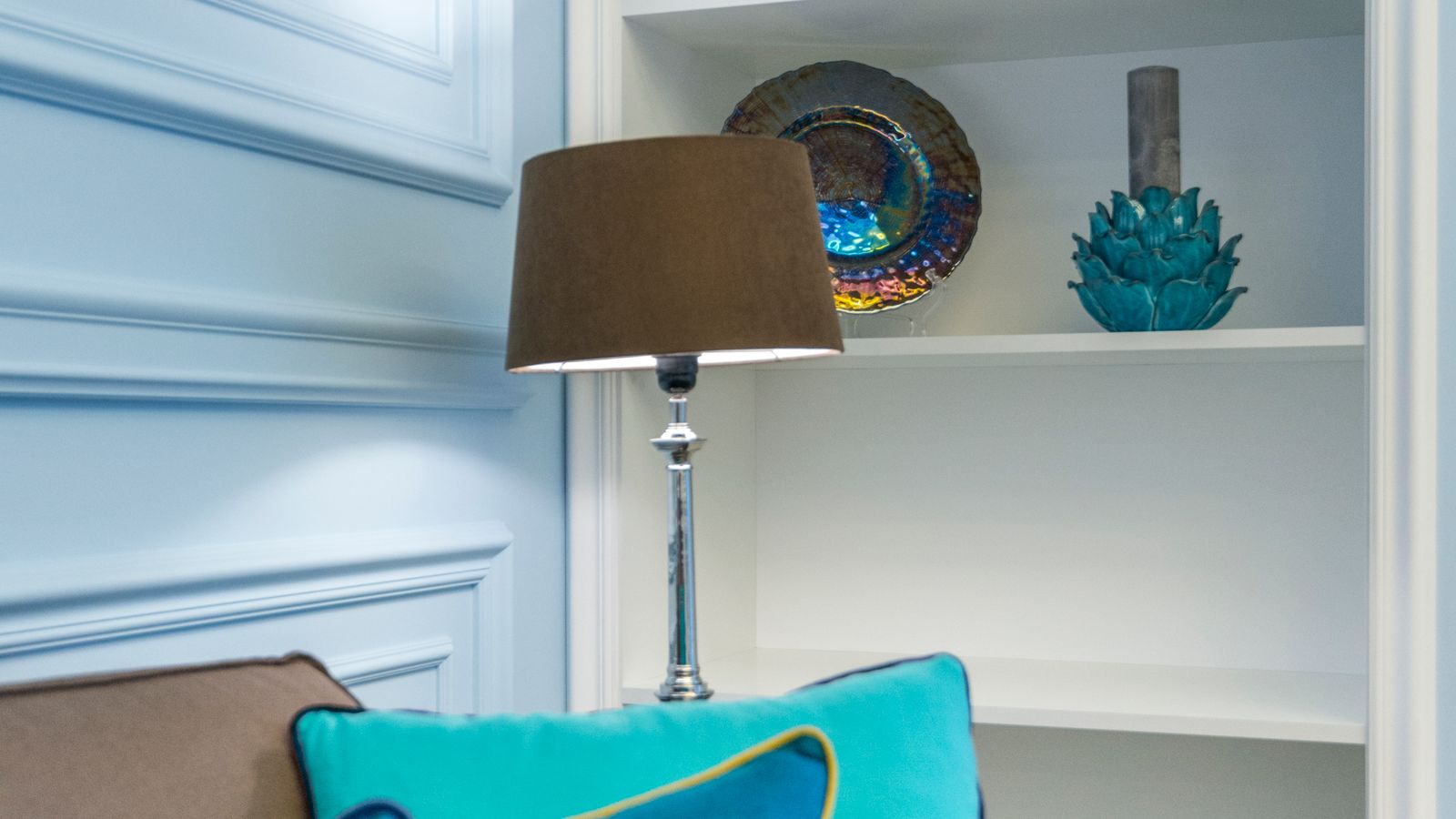 Accent lamp glowing on a side table in a styled living room