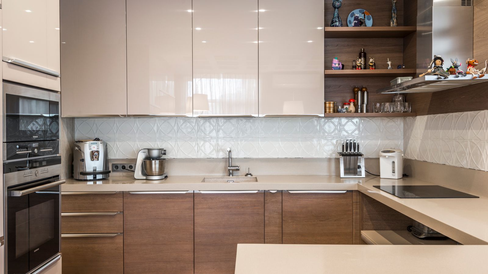 Neatly organized kitchen cabinet with dishware arranged on multiple tiers