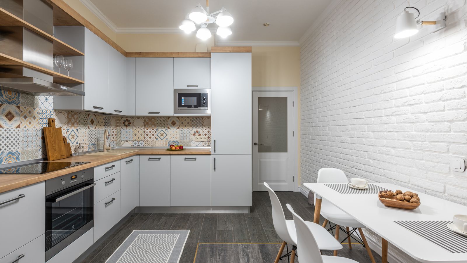 A textured kitchen door mat placed in front of a sink and cabinets