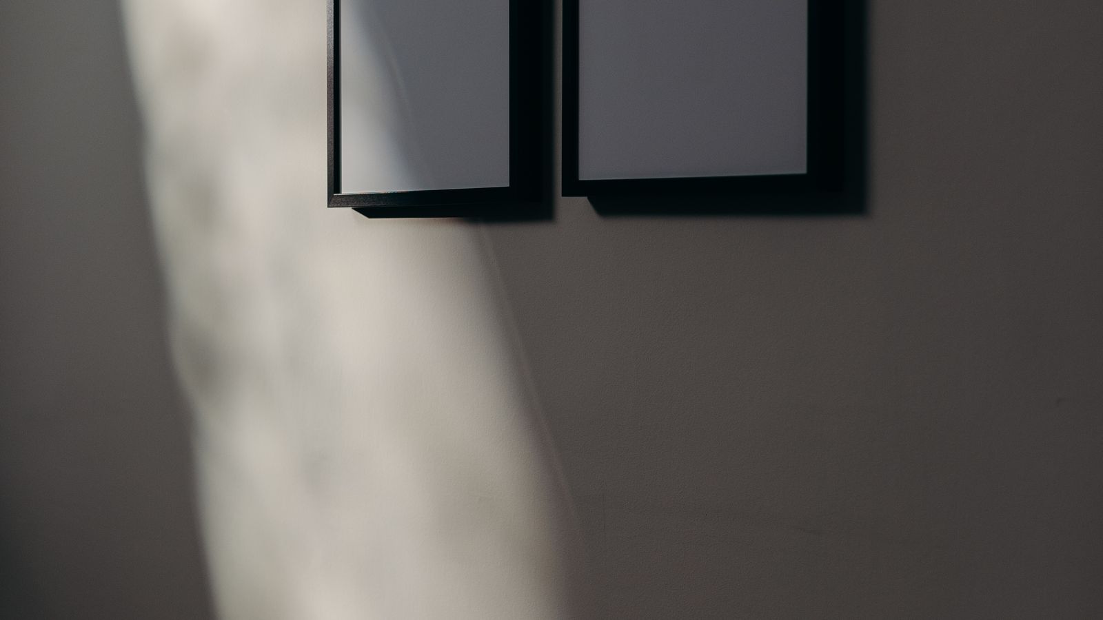 Framed poster art leaning against a living room wall as part of a home decor refresh