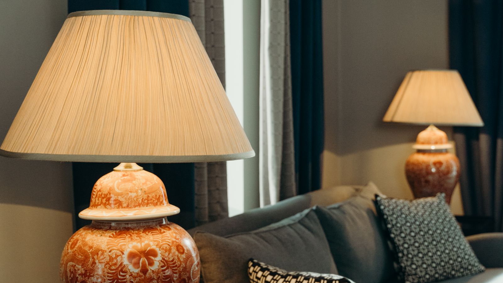 Table lamp with dimmer on a desk beside a laptop in an office setting
