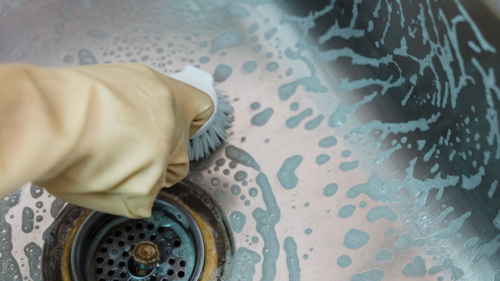 Clean and organized kitchen sink area after a garbage disposal deep clean