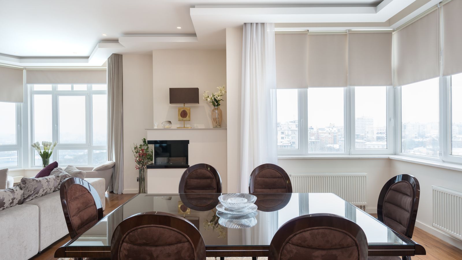 Bright living room window with a single simple curtain panel letting in natural light