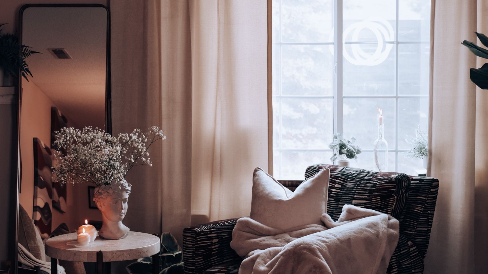 Cozy living room with warm lighting and layered decor showing a cohesive home decor scheme