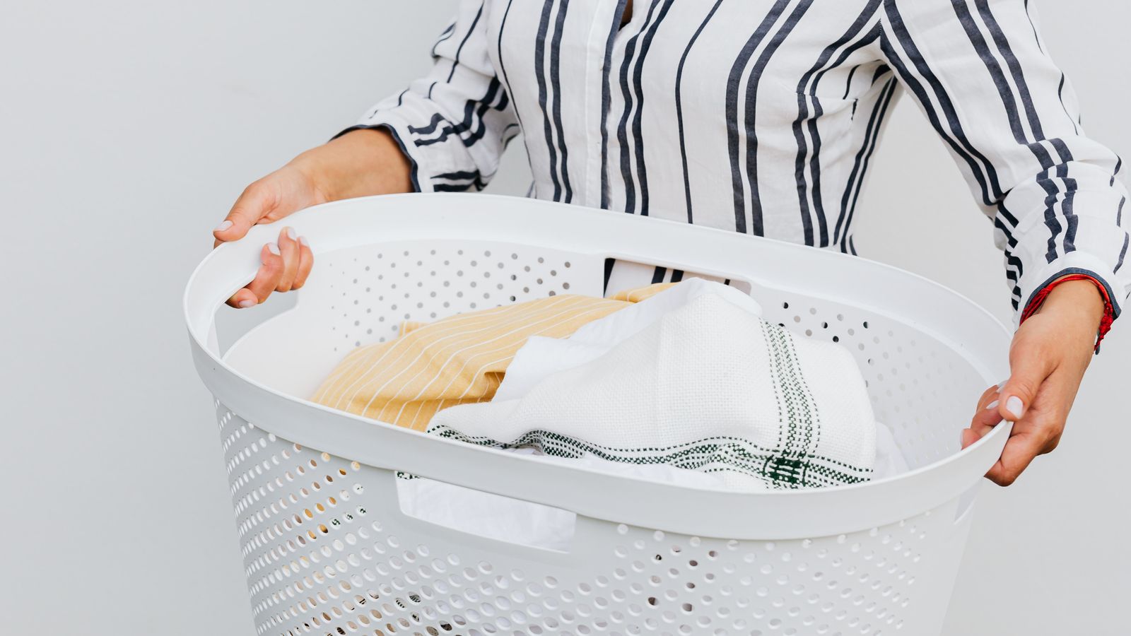 Neatly folded sweaters and clothing stored to prevent pilling and wrinkles