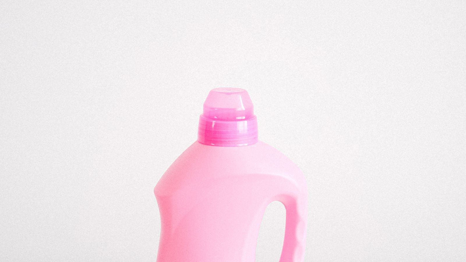Bottles of fabric softener and laundry products arranged for a gift bundle