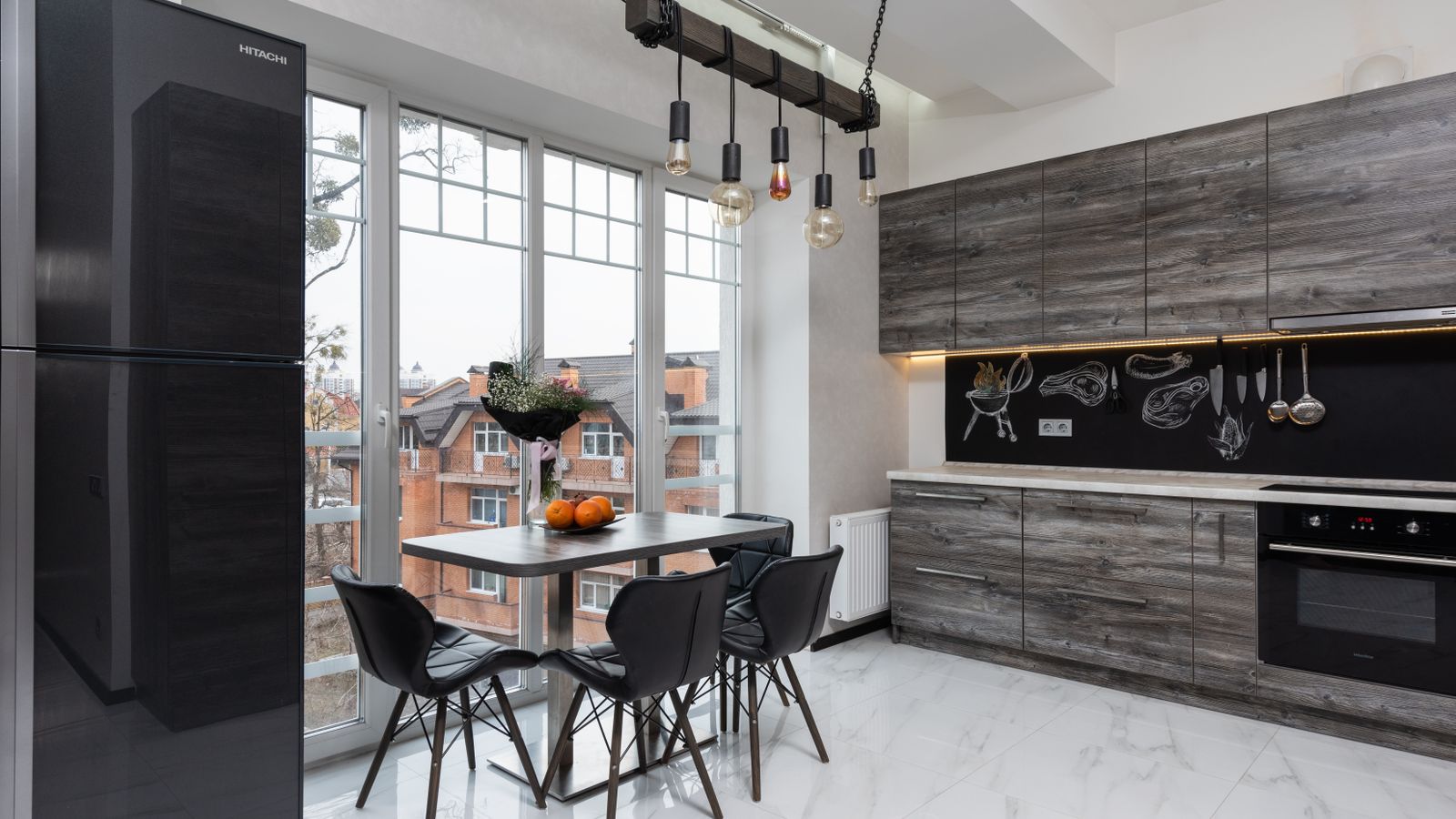 Stainless steel refrigerator in a modern apartment kitchen