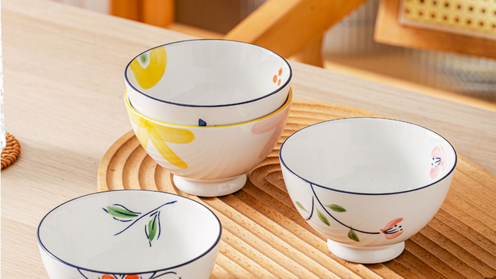 Decorative ceramic bowl displayed as a centerpiece on a wooden table