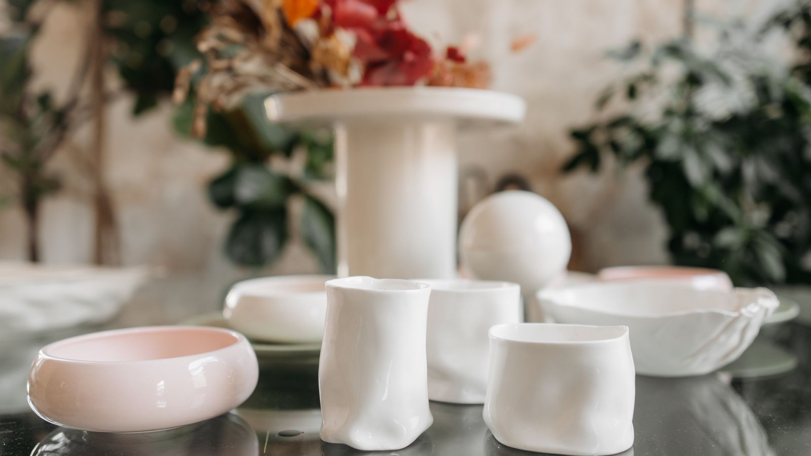 Wooden and ceramic decorative bowls arranged together on a shelf