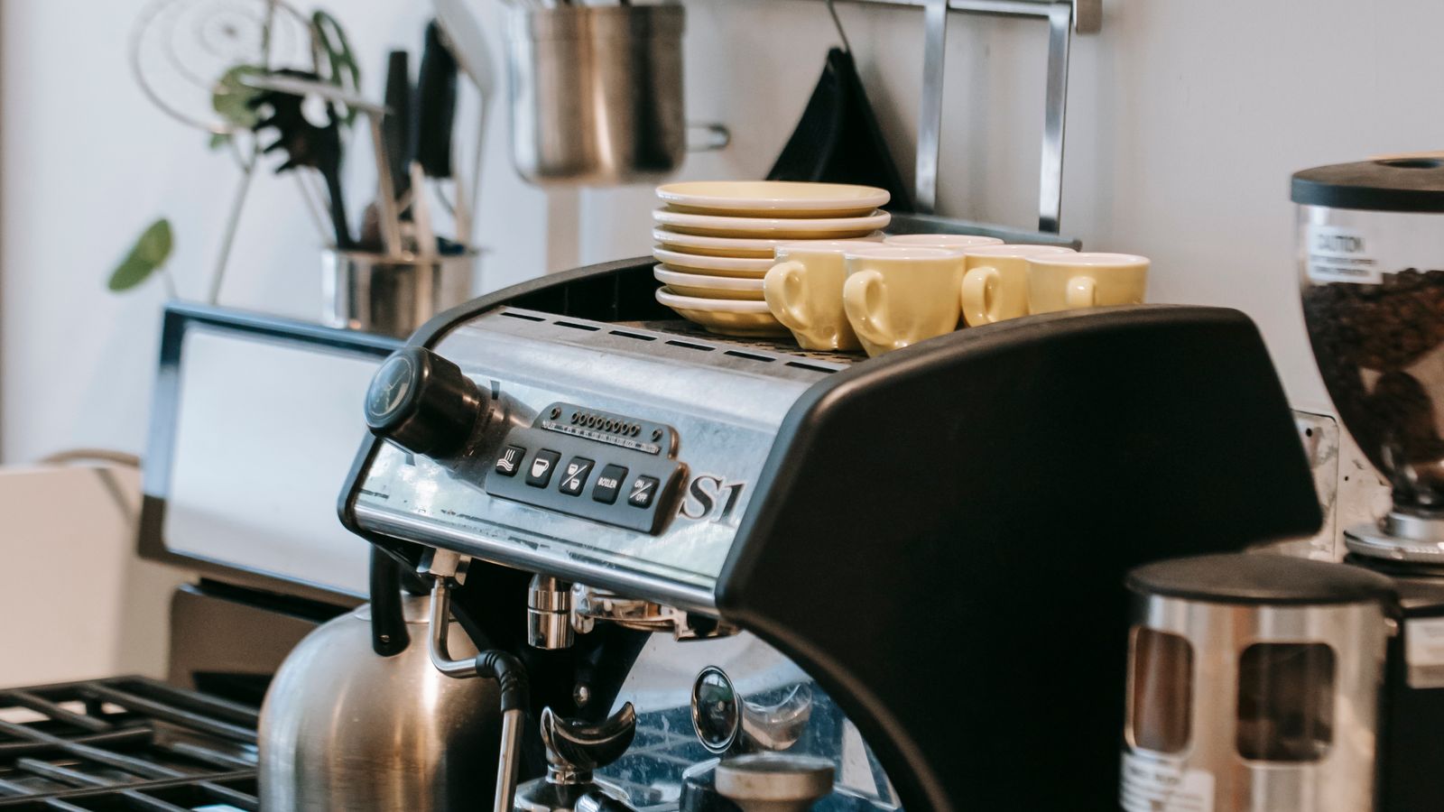 Espresso machine brewing coffee on a modern kitchen countertop