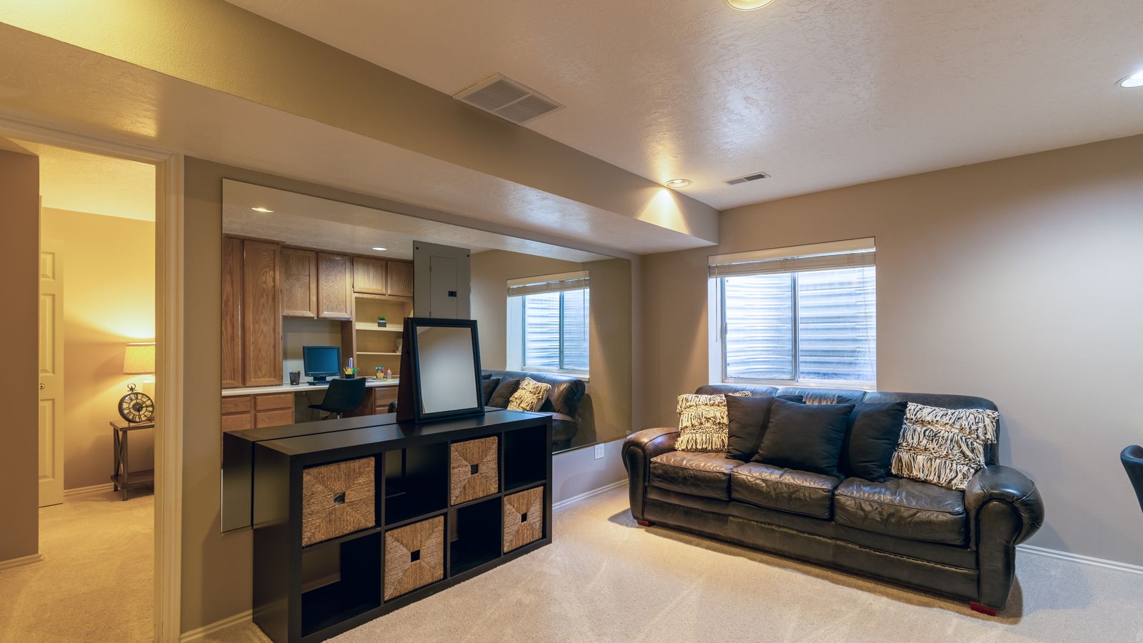 Finished basement space with utility area suitable for a secondary refrigerator