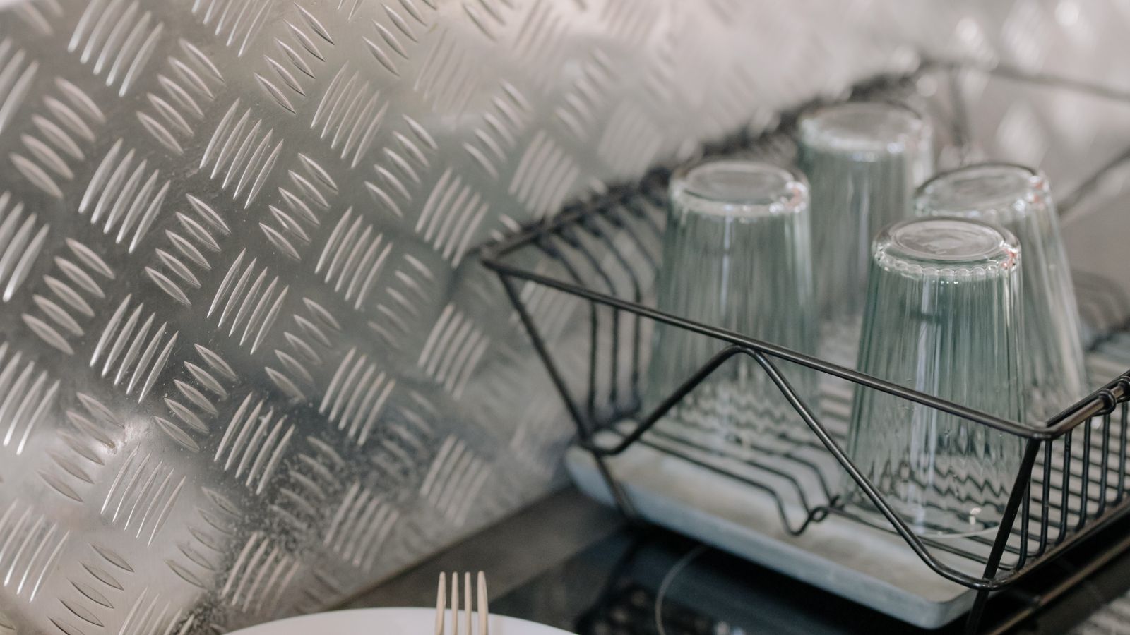 Fabric toaster cover placed on a kitchen counter next to a coffee maker
