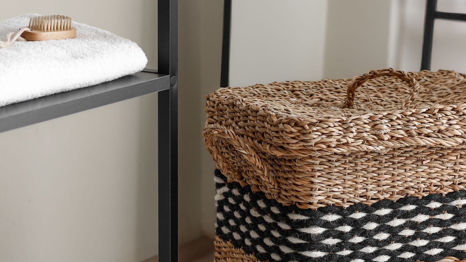 Woven wall mounted hamper styled next to laundry room storage for a coordinated look