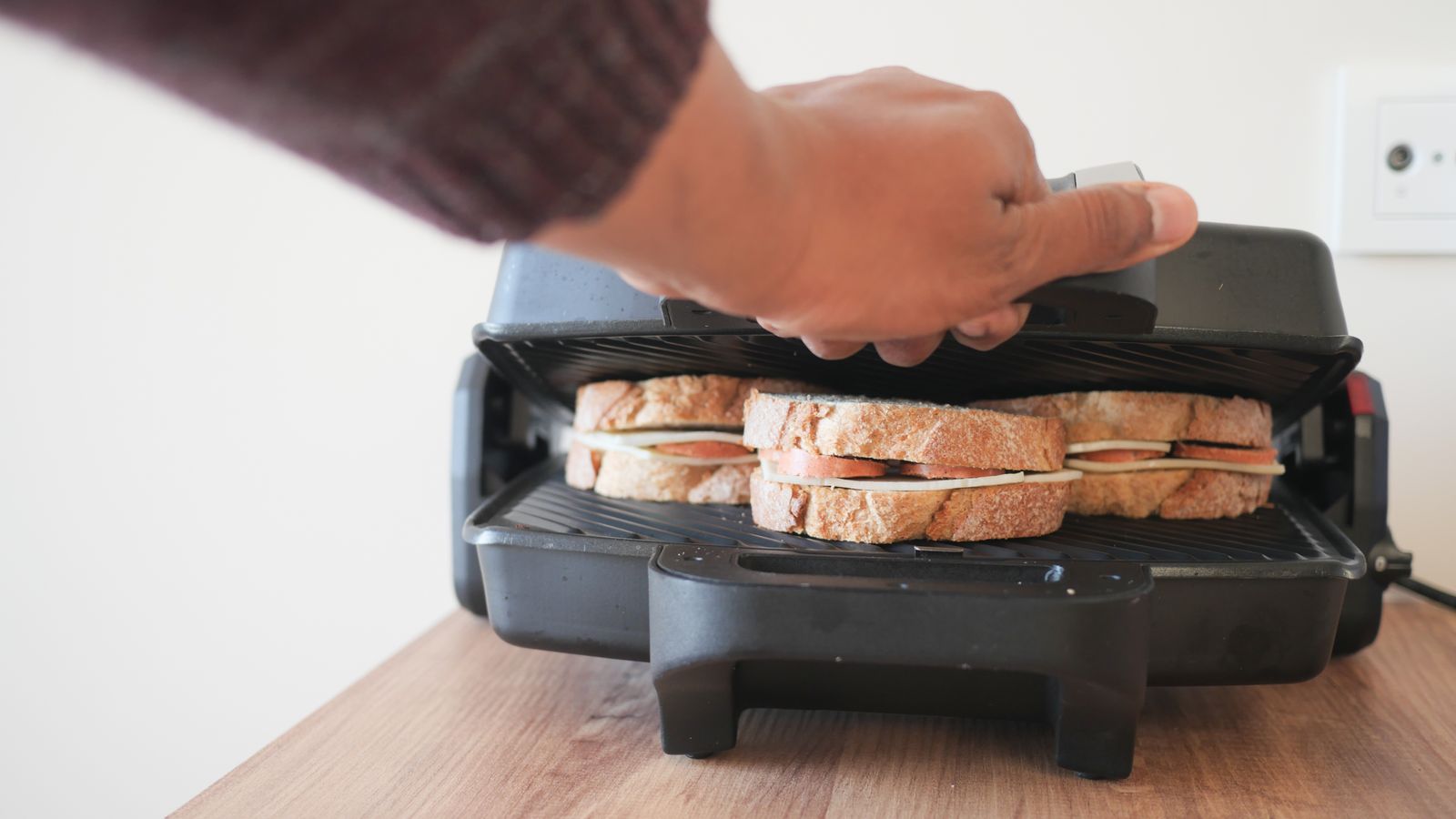 Toasted sandwich pressed on a compact countertop grill press