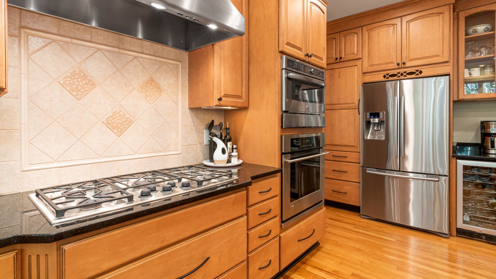 Under-sink cabinet plumbing setup for a kitchen water filtration and dispenser system