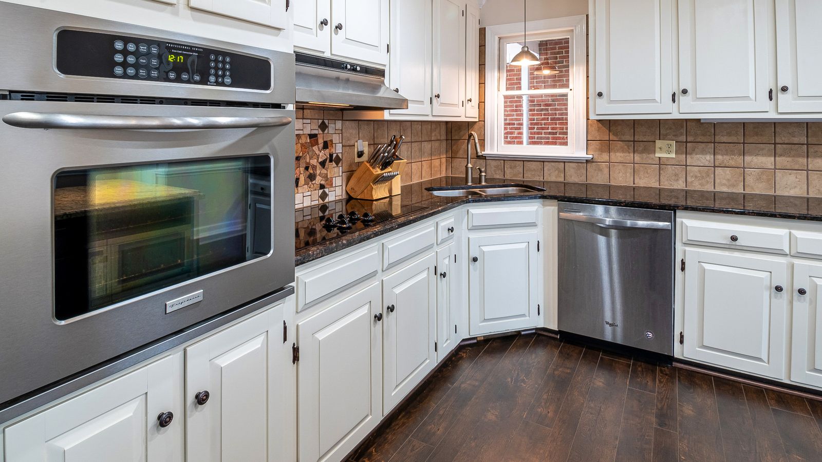 Freshly painted kitchen cabinets in a soft neutral tone during renovation