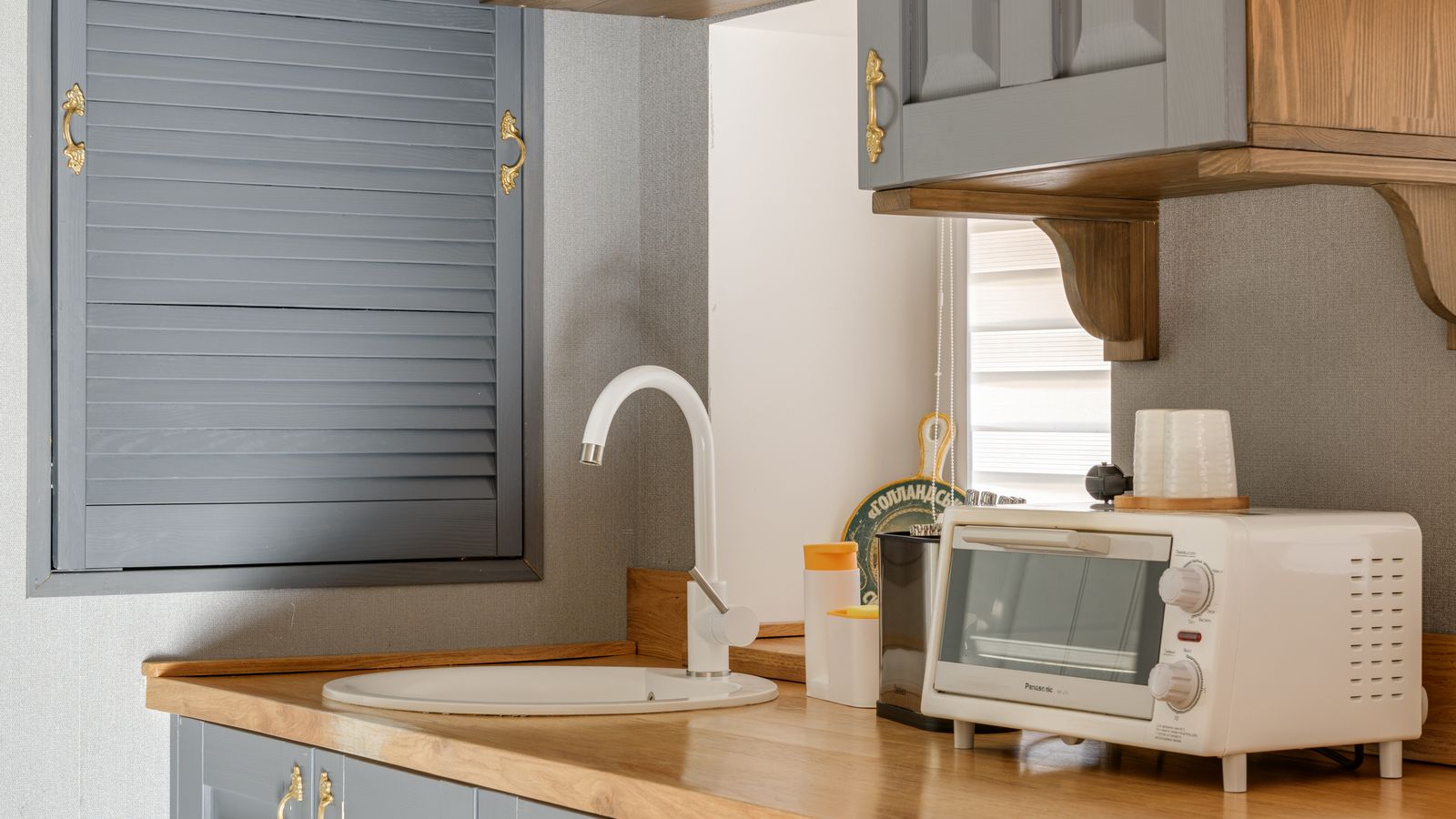Cabinet refacing kit materials laid out for a DIY kitchen upgrade
