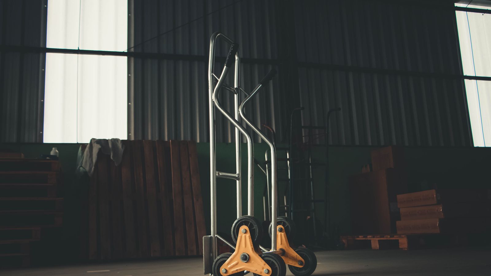 Metal appliance dolly ready for moving a heavy refrigerator