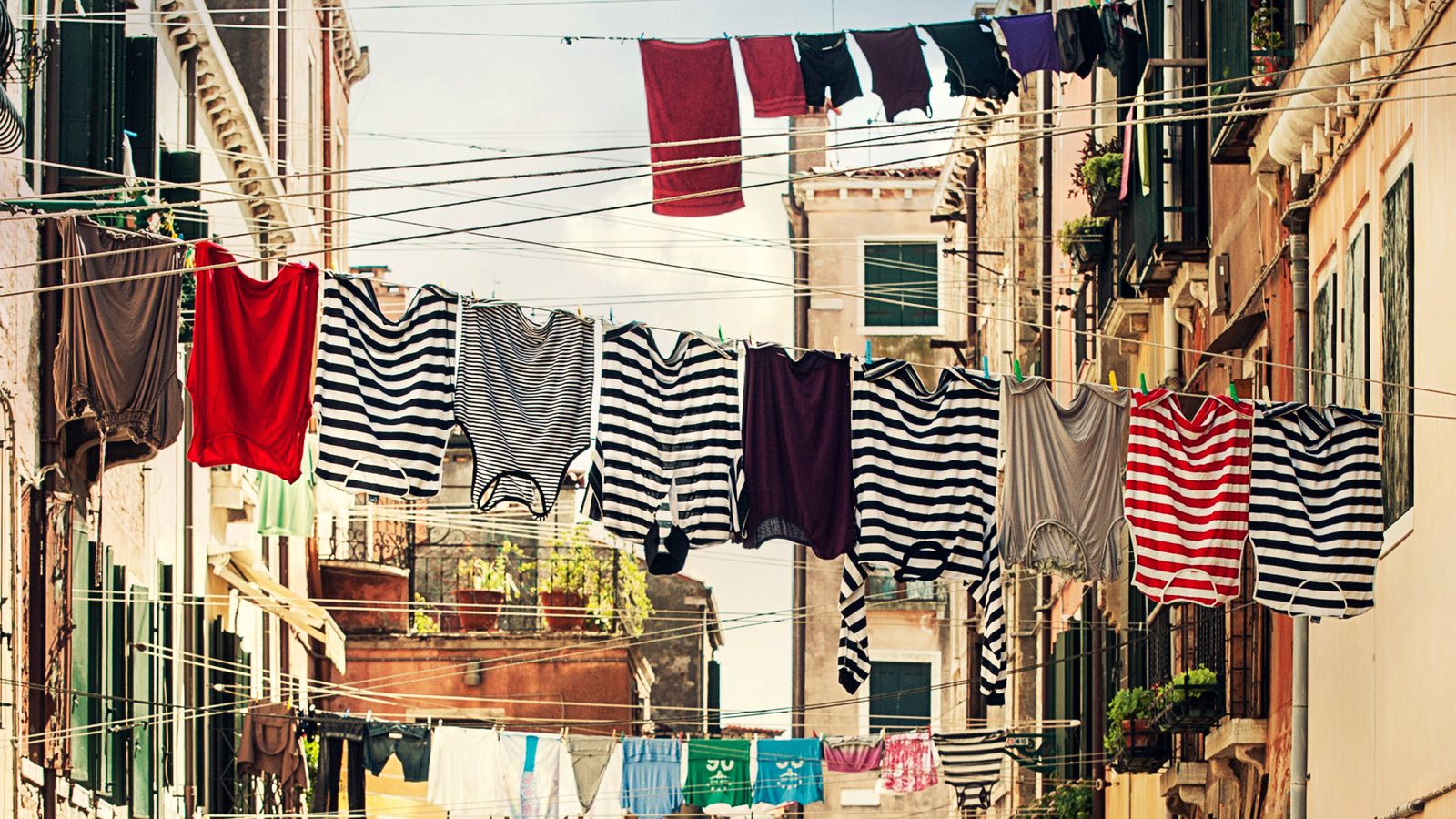 Clothesline with wooden pegs and rope coiled neatly for storage