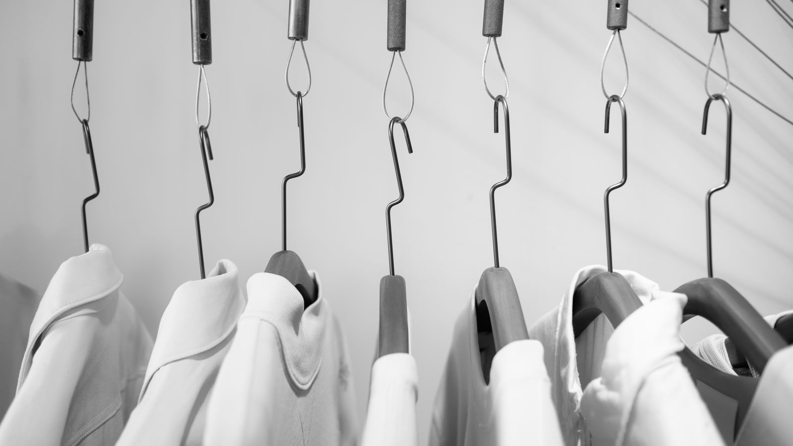 Clean laundry room shelf with storage bins for clothesline accessories