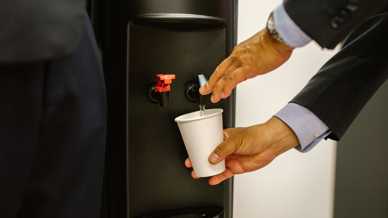 Bottled water cooler dispenser in a home kitchen ready for storage